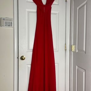 Seasons Designs Inc. Classy red gown with low cut back